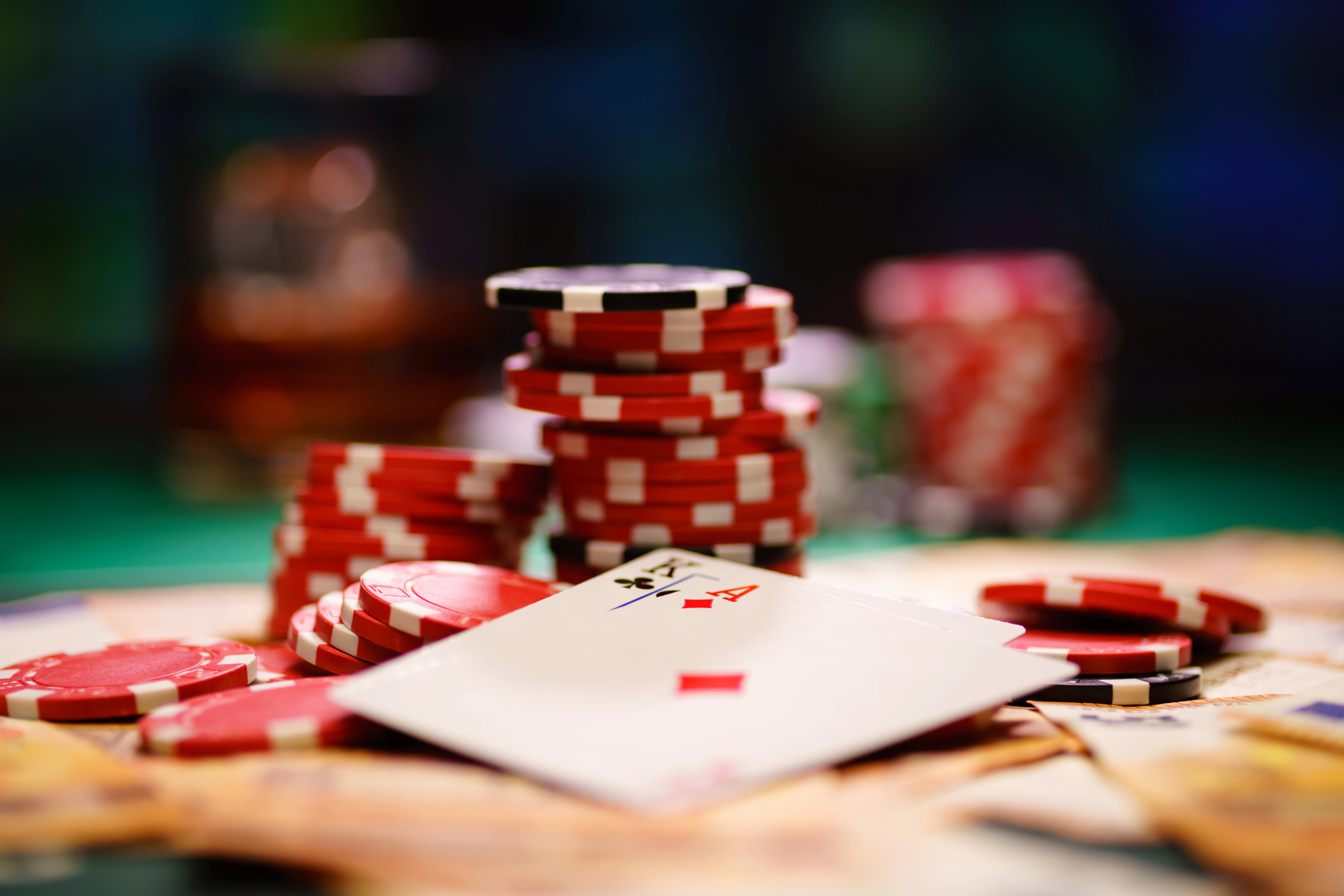 A Stack Of Poker Chips And Some Playing Cards